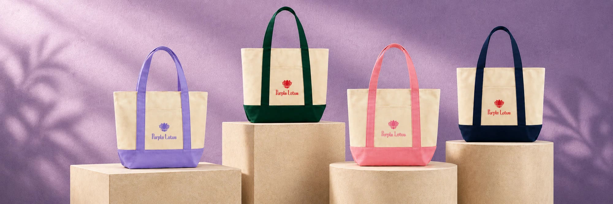 Pink, Green, Navy and Purple Lotus totes on display
